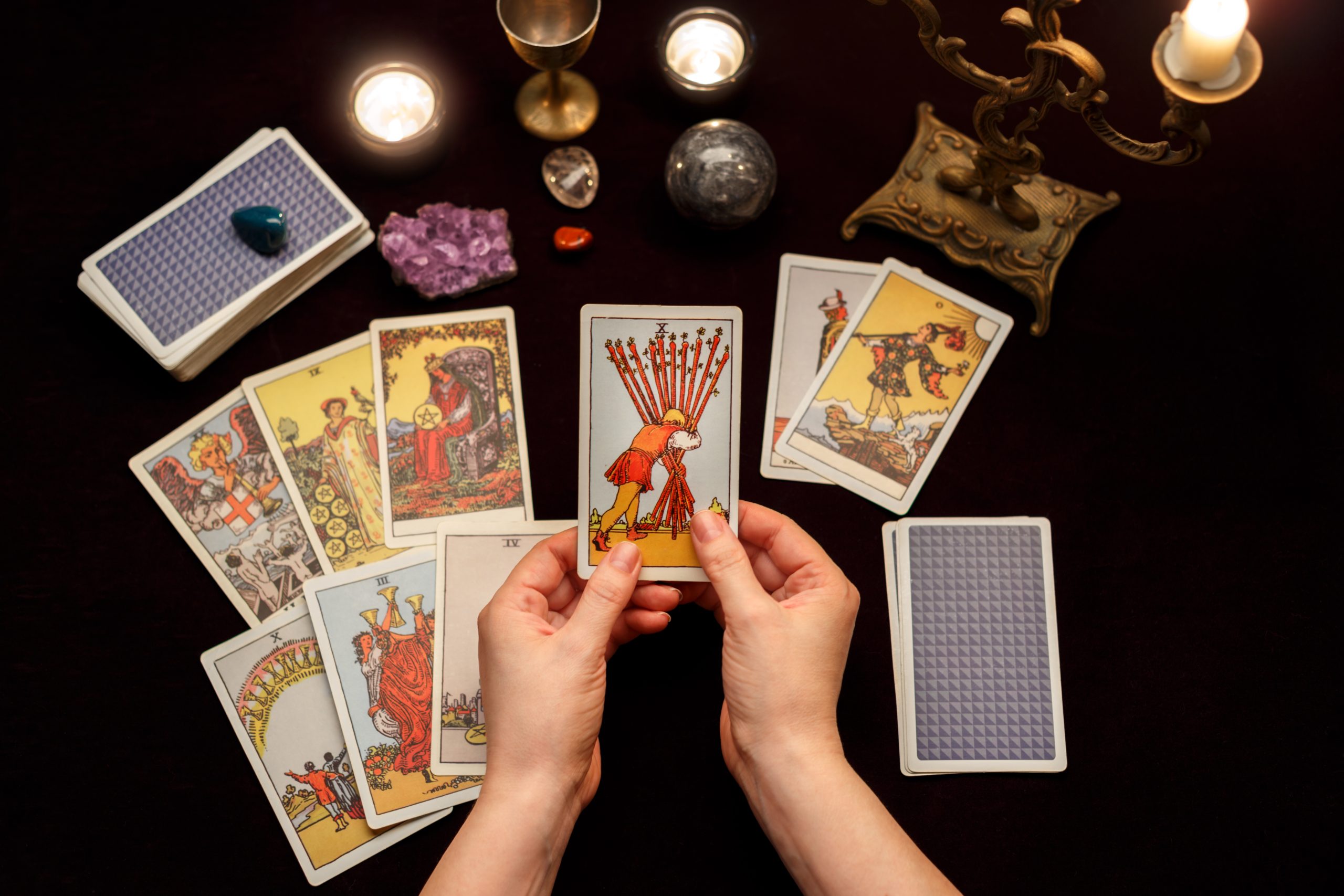 woman hands with tarot cards scaled