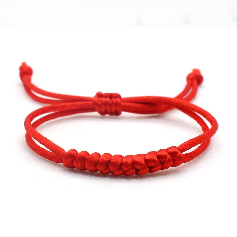 Red string evil eye protection bracelet for a baby